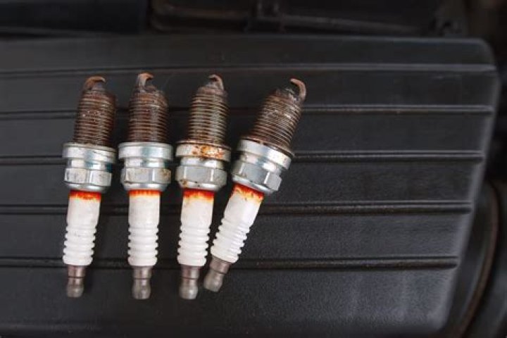 Can bad spark plugs burn oil?