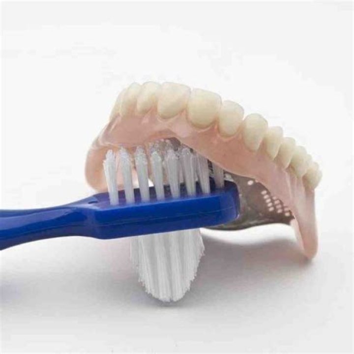 Can you brush dentures with toothpaste?