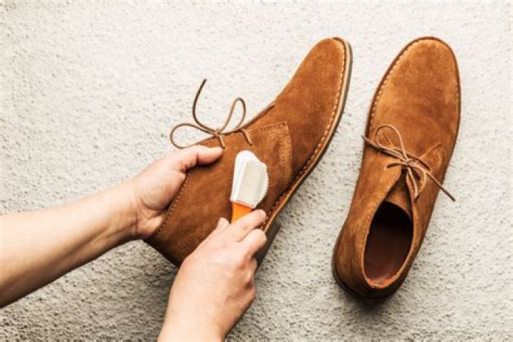 Can you clean suede with soap and water?