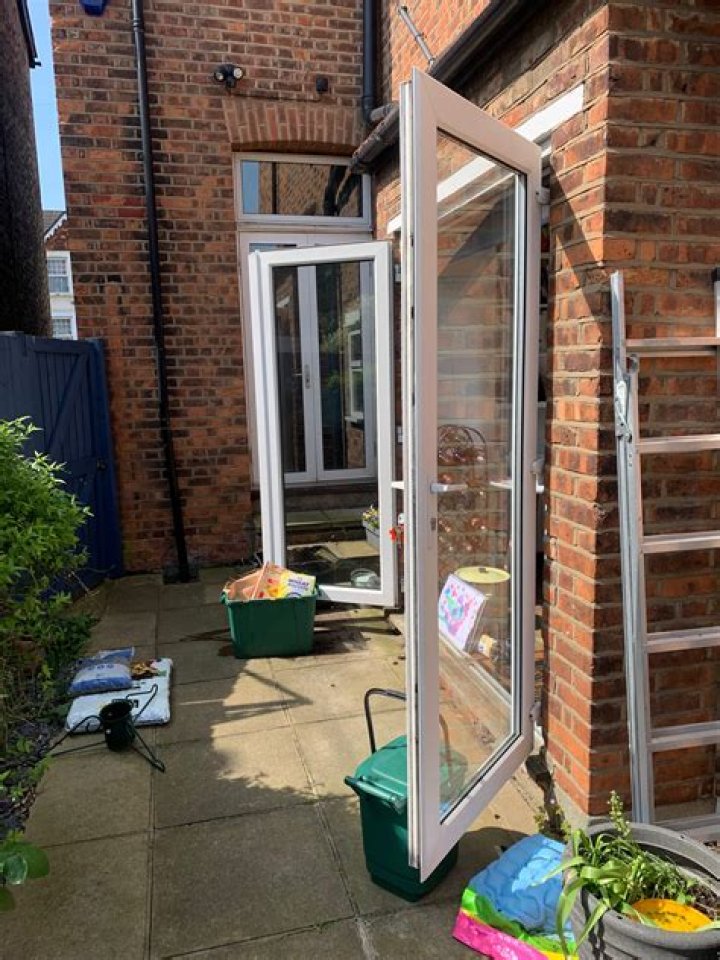 How do I keep my patio door open in the wind?