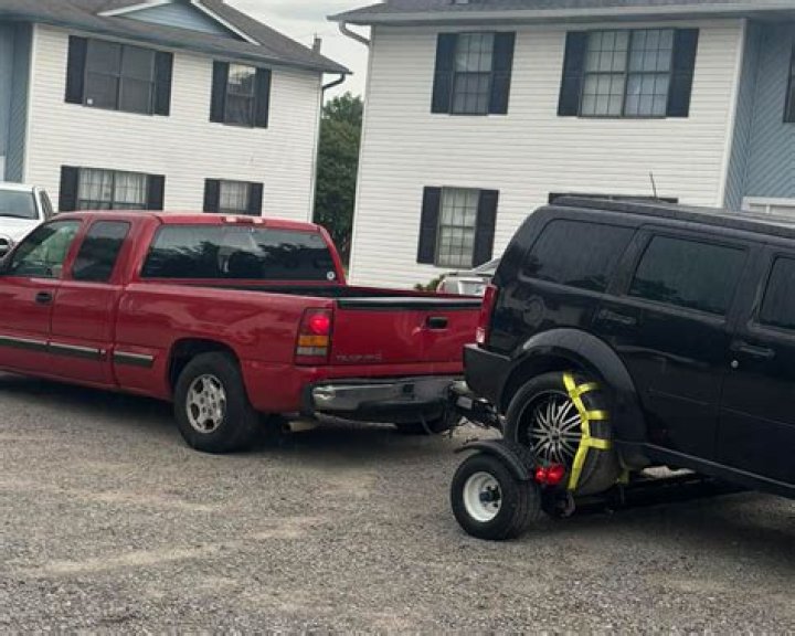 How do I stop my car from rolling backwards?