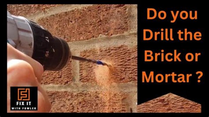 How do you drill into a brick mortar without a hammer drill?