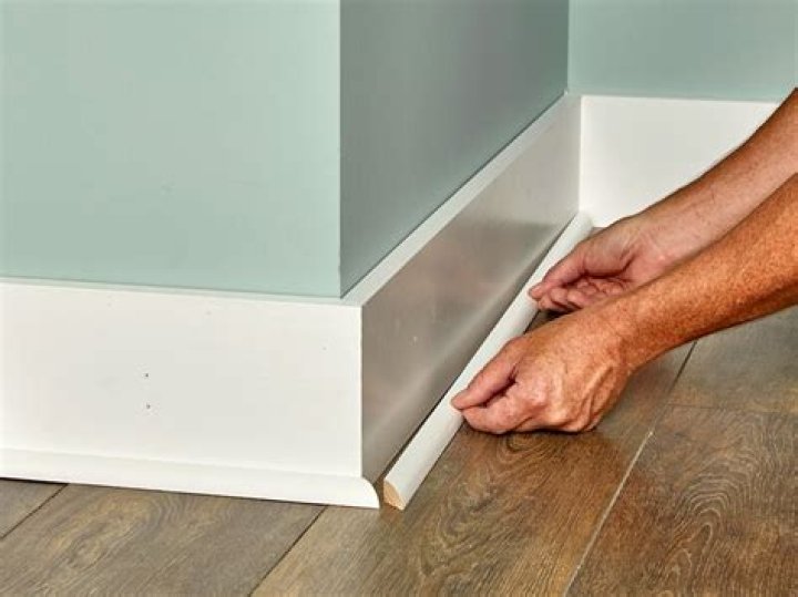 How do you fill gaps in baseboard trim?