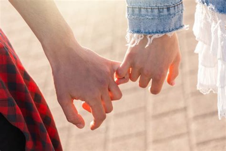 How do you hold hands with a guy?