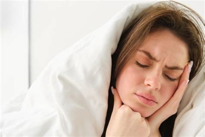 How do you sleep with a throbbing toothache?