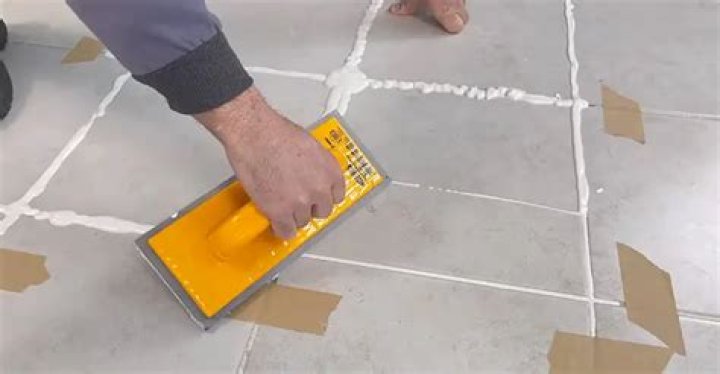How long after grouting can you walk on tile?