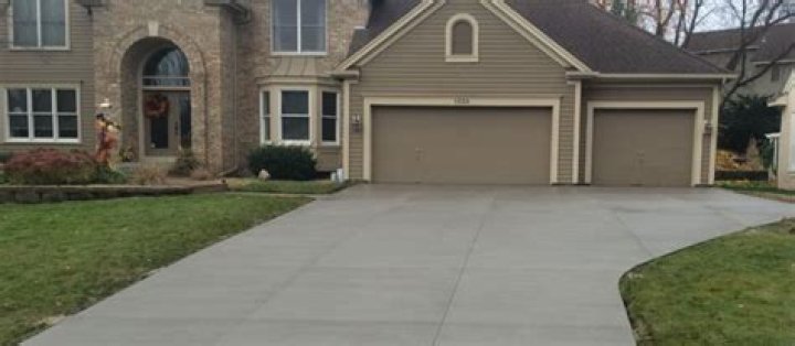Is a concrete driveway cheaper than asphalt?