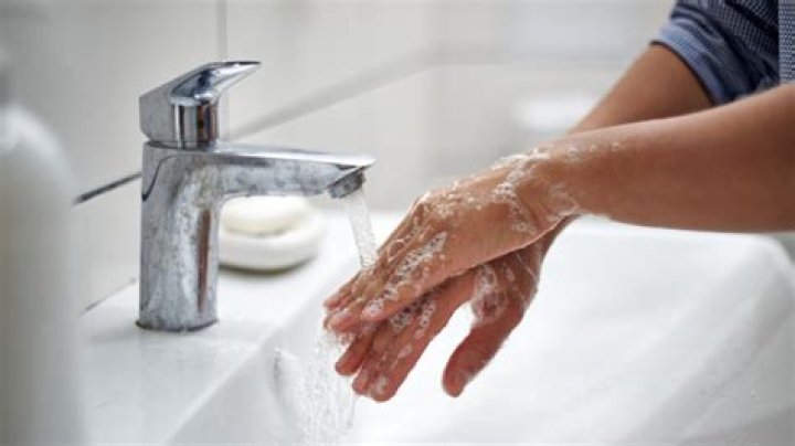 Should a man wash his hands after urinating?