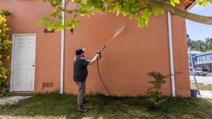Should I power wash my house before I paint it?