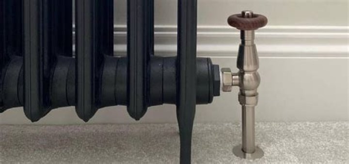 Should radiators be hotter at top than bottom?