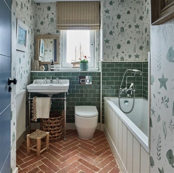 Should you tile behind a toilet?