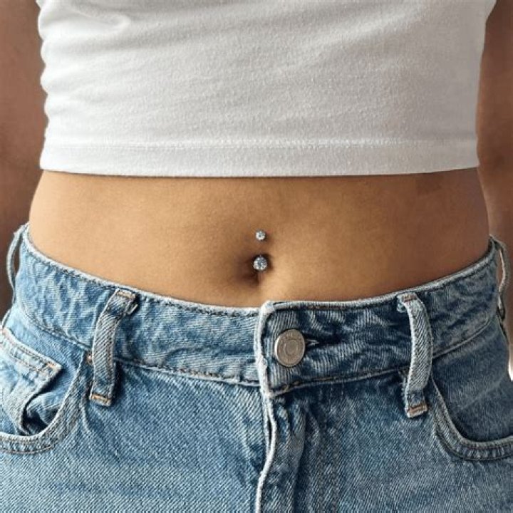 What celebs have a belly button piercing?