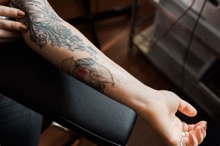 What does healthy tattoo scabbing look like?