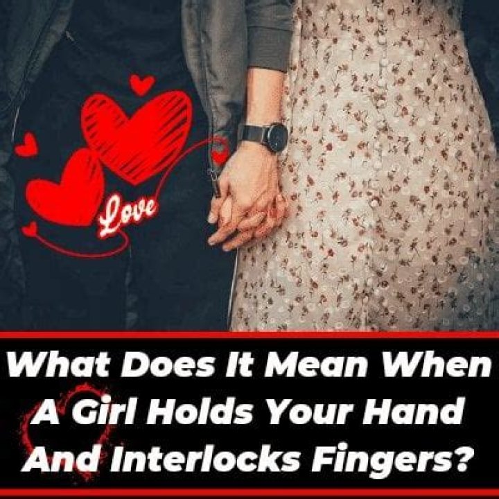 What does it mean when a girl holds your hand tight?