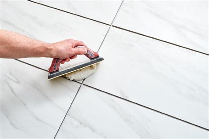 What is grouting in tiles?