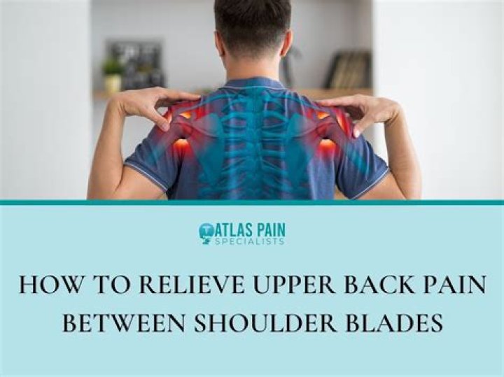 What is pain between shoulder blades a symptom of?