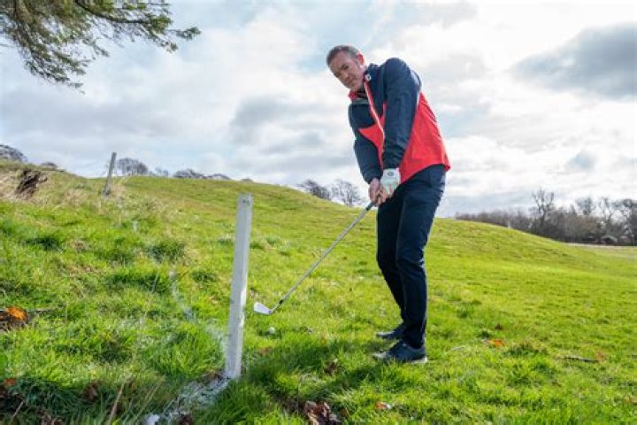 What is the penalty for red stakes in golf?