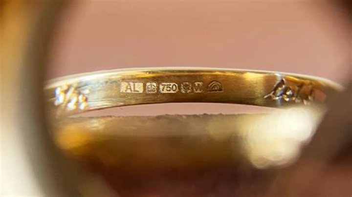 What is white gold stamped with?