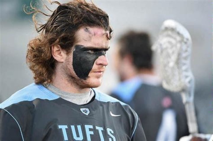 Why do football players wear paint under their eyes?