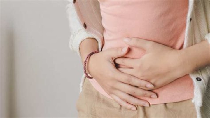 Why do I feel like I have a tight band around my stomach?