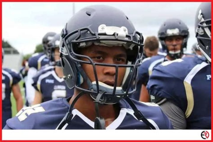 Why do quarterbacks tap their helmets?